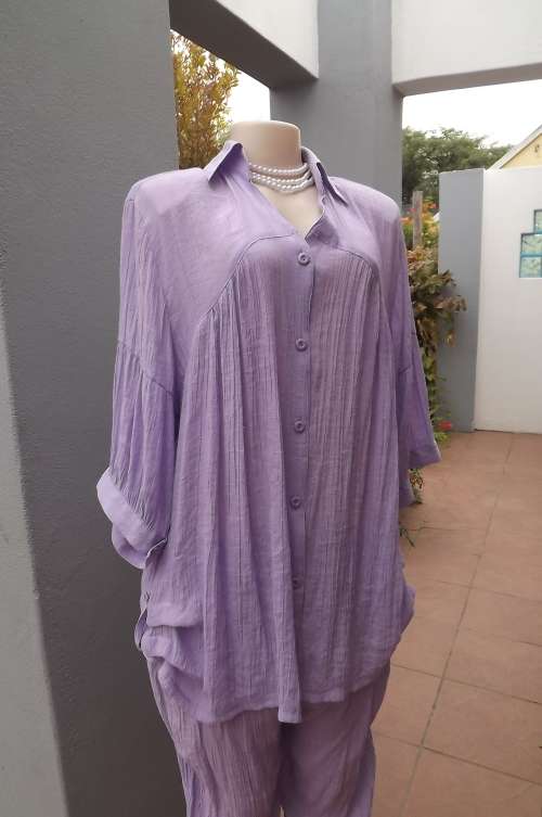 Lavender two piece outfit by TV COLLECTION.Soft creased cropped pants and voluptuous jacket