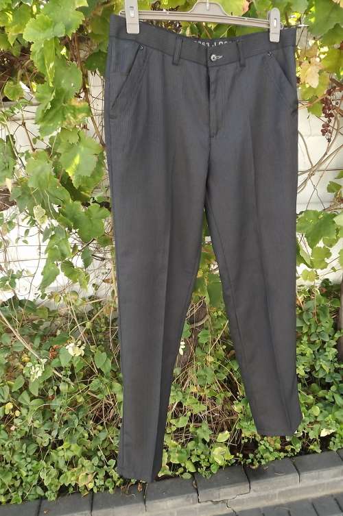 Men`s as new pants in viscose/ polyester blend.in black and white vertical stripes.Size 34 by ENZO.