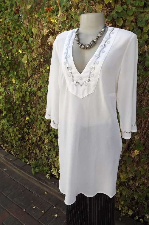 Creased 100% polyester long top from FOSHINI in size 38/14.New condition.