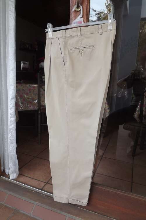 Men's Chinos in pure cotton.Size 38/97cm by WOOLWORTHS.Beige colour.With turn ups on legs.