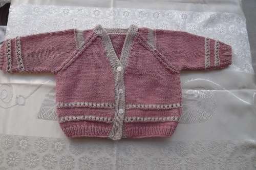 Pretty pink and beige cardigan for 12 month old girl.Hand knitted in acrylic wool.New condition.