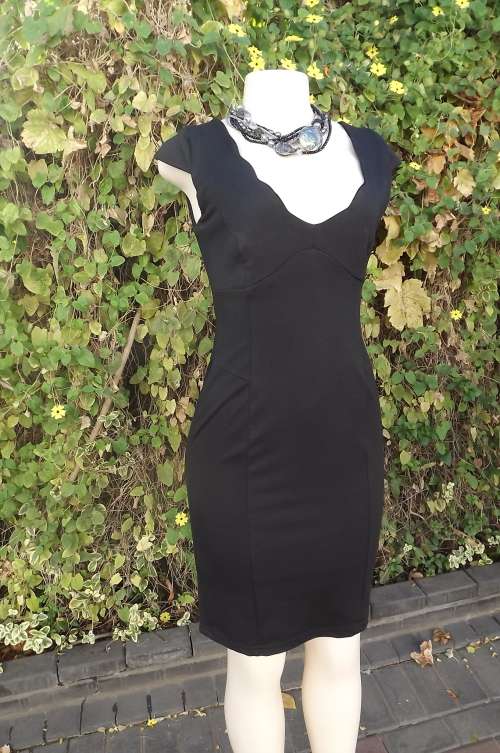 Beautiful black stretch body hugging dress in size 32/8 by MASSUMI.Perfect fit.AS new