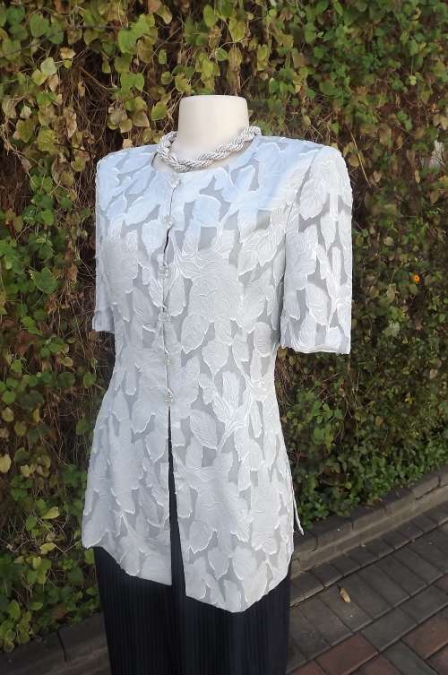 Smart silvergrey sheer embossed long styled top.Fully lined but for sleeves by SIOR DOLCE