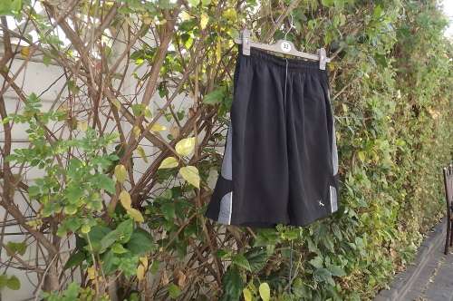 Black silky polyester men's shorts with elasticated middle and drawstring.Size M by MAXED