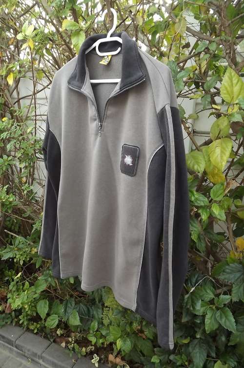 Warm beige/grey pullover polyester/fleeze top by SPIN in size L.Short zip on front with collar