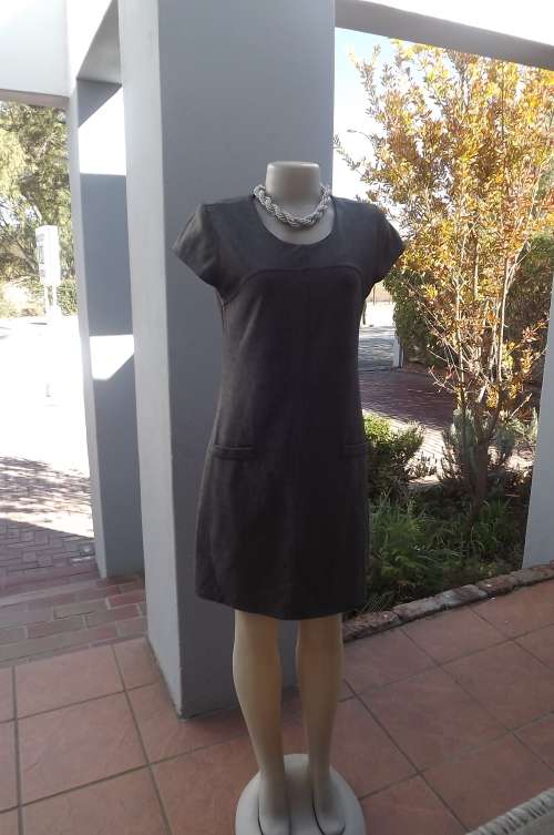 Grey shift dress with yoked front and dummy pockets.By COOL ICE in size 34/10.Good condition