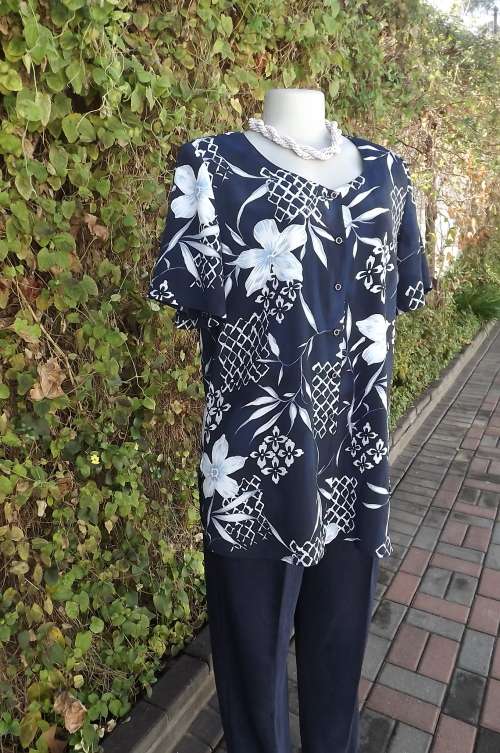 Beautiful navy collarless top with bold light blue floral design.By MERIEN HALL CASUALS