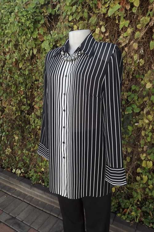 Warm up your look with a monochrome vertically striped button down top.Size 38/14