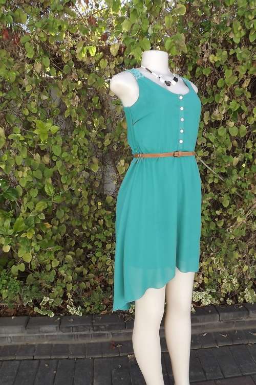 Seagreen dress with high/low seam.Low rounded neckline with button down top.Size 28/4