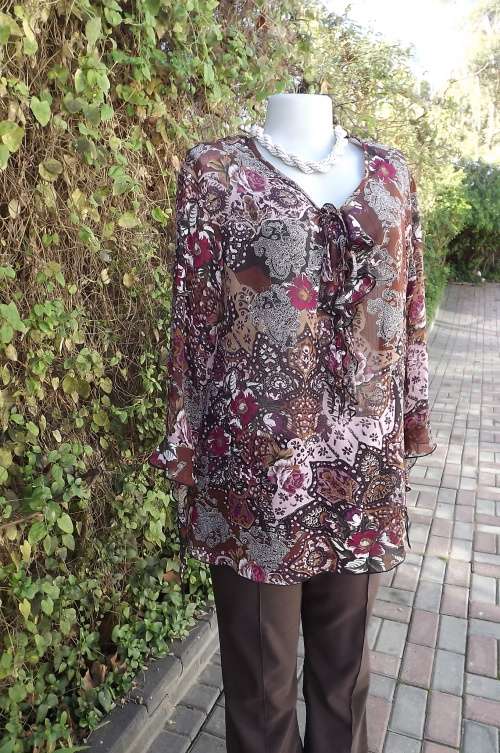 Top in fabulous colours with paisley design.Golden brown background with pink and purple