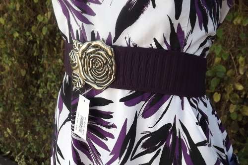 New dark purple stretch belt with brass buckle in floral design.Width of belt  4.75cm.