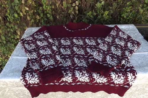 Handknitted maroon poloneck pullover cardigan.Done in fair aisle pattern in beige and light blue