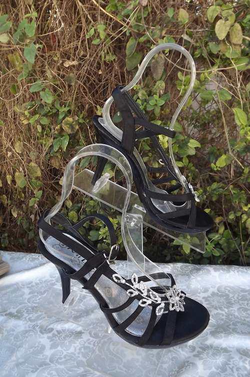 Black evening high heels shoes.Satin covered straps with floral silver decoration.As new.