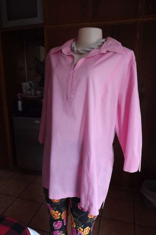 Beautiful pull over top by EXACT in size 44/20 in Salmon pink with elbow length sleeves.