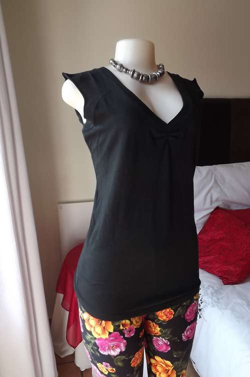 Black stretch cotton top by LEGIT in size 40/16.Back and front v neck.Short cut-on sleeves.