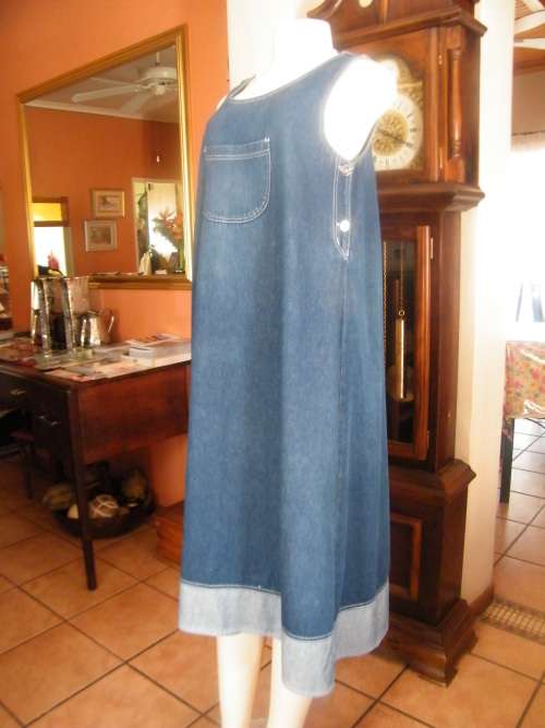Chic denim dress for the mum to be!Size 36/12.Sleeveless with pockets on front.As new