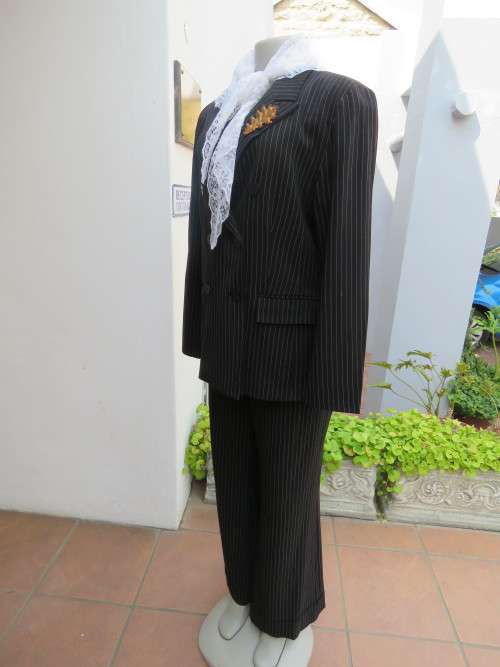 Black and white 2 piece pin stripe pant suite by FINNEGANS in size 38/14.As new