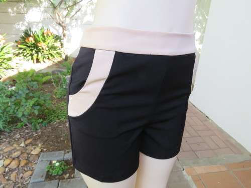Smart Black and rich cream tailored shorts.Two front pockets at sides by SWEETY C size 34/10