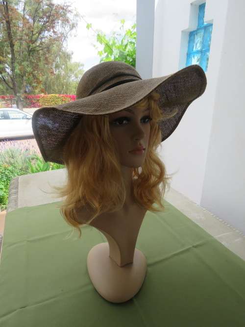 Golden brown wide brim hessian hat with bow at back.Black trimming.Good condition.Size 57