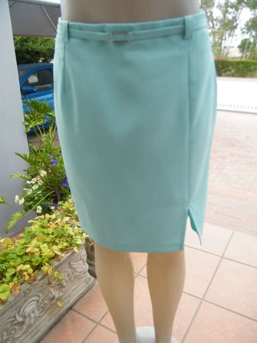 Chic knee length light turquoise pencil skirt.Size 36/12 by TRUWORTHS.Bandless with belt and buckle