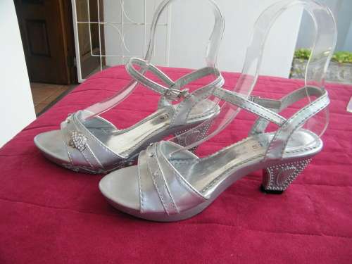 Pair of silver sandles with strap over fppt.Size 2 by TRAVIS COLLECTION.New condition