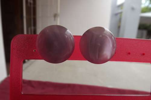 Pair of dusty pink plastic clip-on earrings.As new.Diameter 2.3cm