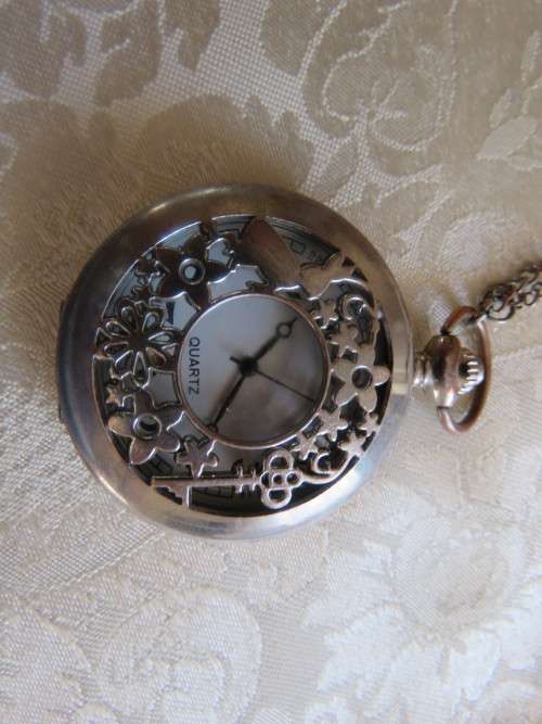 Pretty quartz pocket watch with chain.Need battery