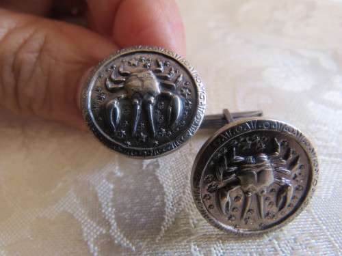 Pair of antique cufflinks.Round with crab design.As new