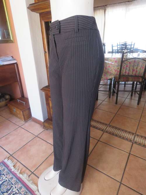 Smart black pinstripe pants by DIJON in size 36/12.Two front dummy pockets.Straight legged.