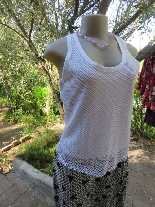 White vest style top by NEWS casuals in size 34/10.Polycotton with polyester mesh overlay