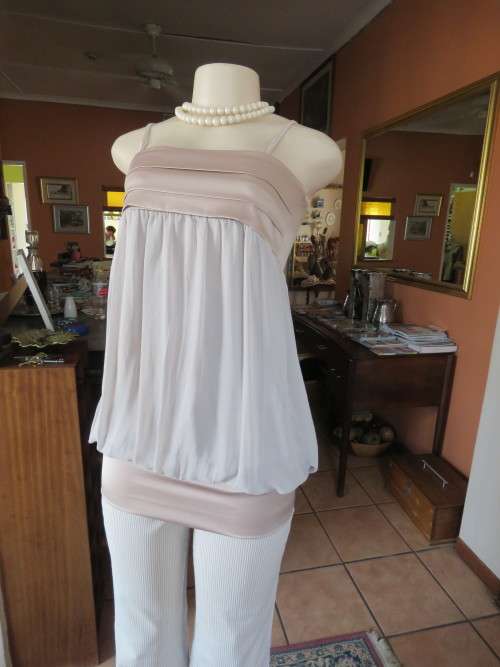Must have coffee colour strappy top in size 30/6.Polyester satin bust and band around hips