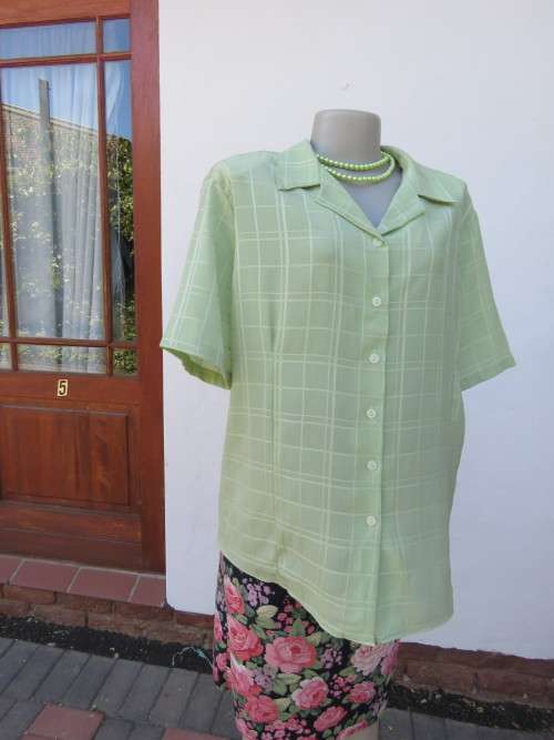 Mintgreen short sleeve blouse in stunning textured polyester fabric with check pattern.Size 48/24