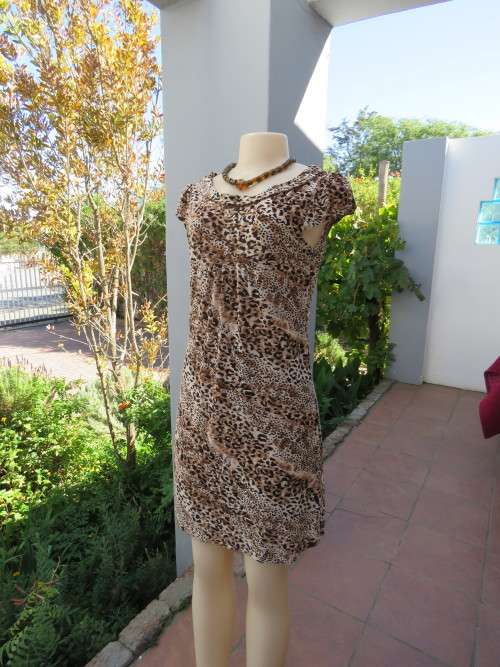Animal print dress with capped sleeves.Yoked front with gathering.Size 34/10.Soft portret collar
