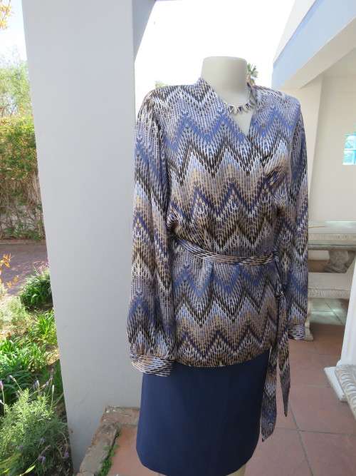 State of the art soft silky cross over blouse by 'WOOLWORTHS' in 44/20.New condition.