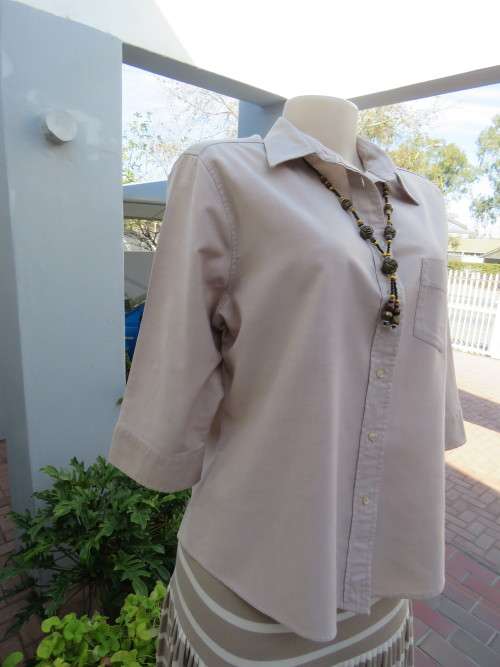 Preppy beige shirt with cuffed elbow length sleeves.By 'WOOLWORTHS' in 38/14.As new.