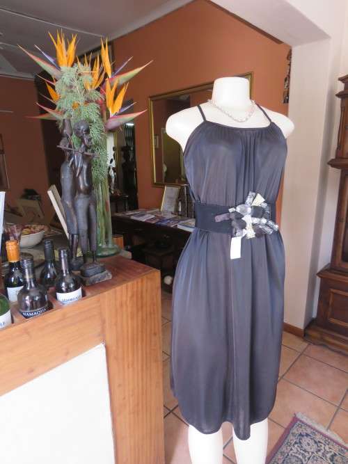 Amazing black  strappy dress with cross over back by 'ALLEY CAT' in 32/8.Good condition.