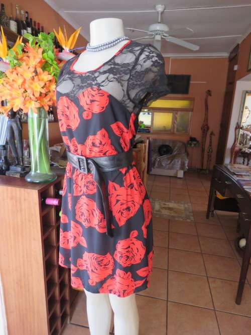 Ultra chic black dress with bold red roses by 'COLOR THREAD' in 32/8.Made in Cambodia.New item.
