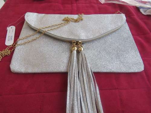 New silver evening bag.Large size to keep all the necessities.In envelope style.Still wrapped.