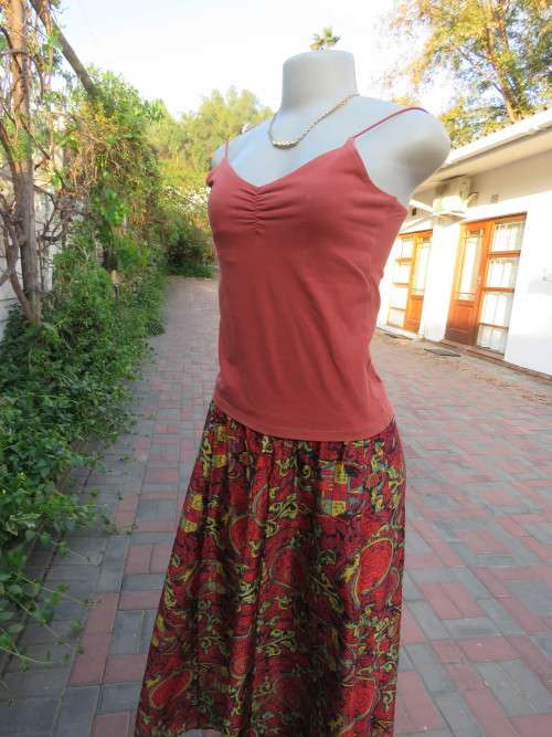 Brick colour stretch cotton 'LEGIT' top with straps in size 34/10.Used but in good condition.