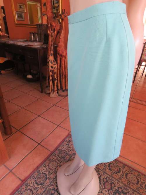Fully lined 37/13 pencil skirt in light turquoise.In textured heavy polyester fabric.Good condition.