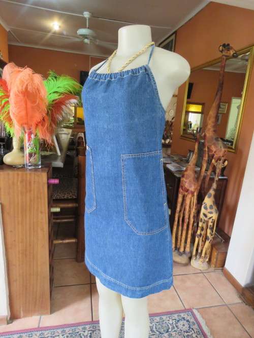 Chic denim dress with halter neck.By 'DIESEL' in size 30/6.In 100% cotton fabric.Good condition.