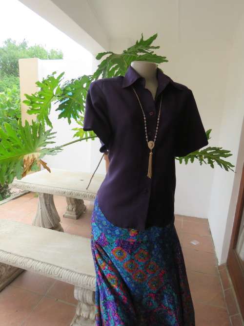 Dark purple button down top with short sleeves.Boutique made in size 36/12.Good condition.