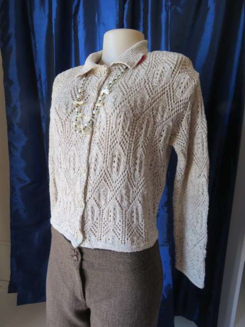 Knitted cropped long sleeve cardigan in 100% acrylic.In beige by 'FOSCHINI' in size 38/14.New cond.