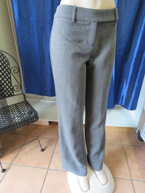 Warm dress pants in black/white mottled fabric.Boot legged.By 'EXACT' in size 36/12.As new.