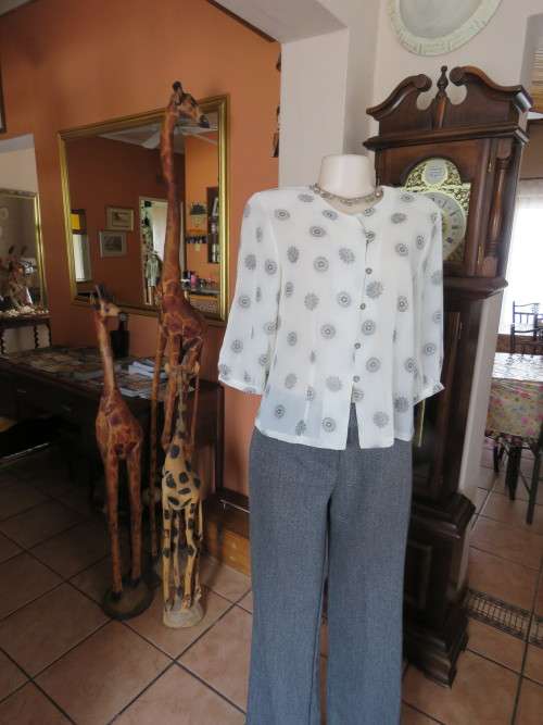 Ultra chic cream top with black lacy circle patterns.Boutique made.Size 36/12.New top.