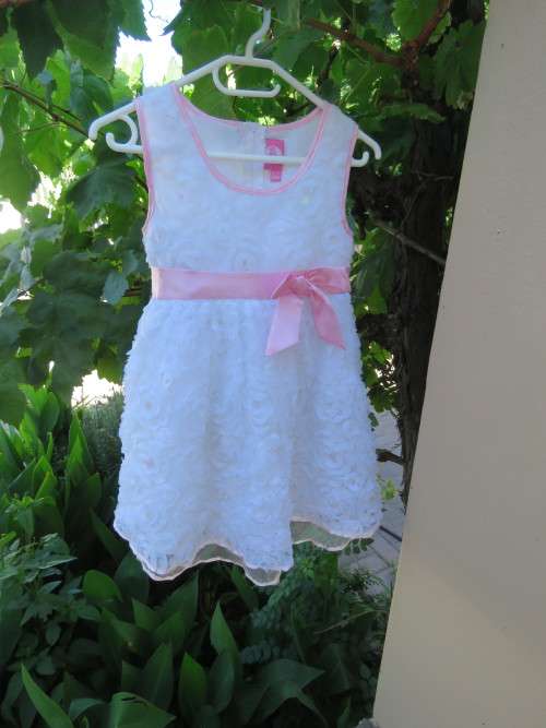 For your little girl by OTEE for 6-7 year old girl.In netting covered with flowers/sequences.As new.