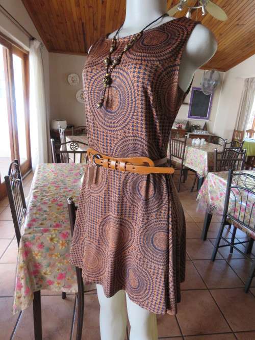 Sleeveless brick colour dress with black houndstooth pattern and circles.By 'DRAMAQUEEN' in 34.New