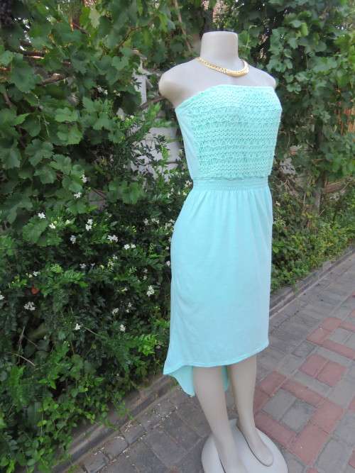 Flirty strapless dress in pale mint green by 'RED' in size 32/8.In polyester stretch fabric.As new.