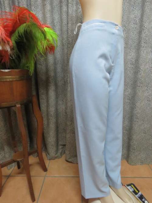 High waist dress pants in light blue with straight legs.Size 36/12.In 100% polyester.As new.
