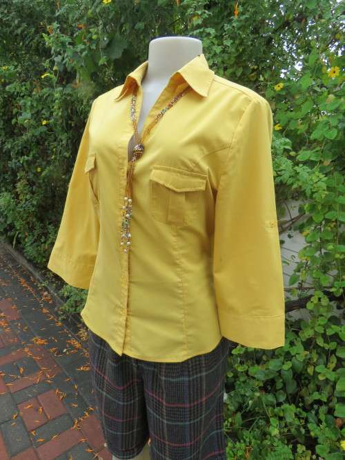 Fashion top in mustard colour with 2 cute pockets on front.By `MASSUMI` in 36/12.New condition.